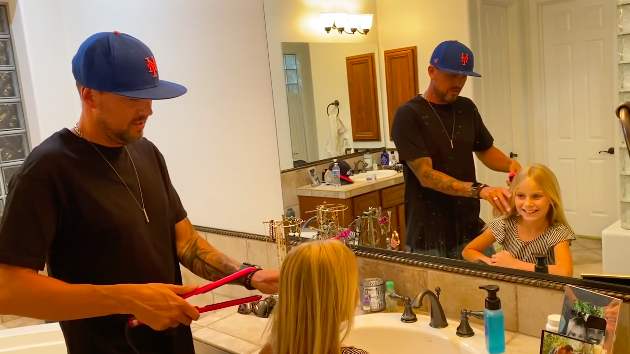 father styling daughter's hair