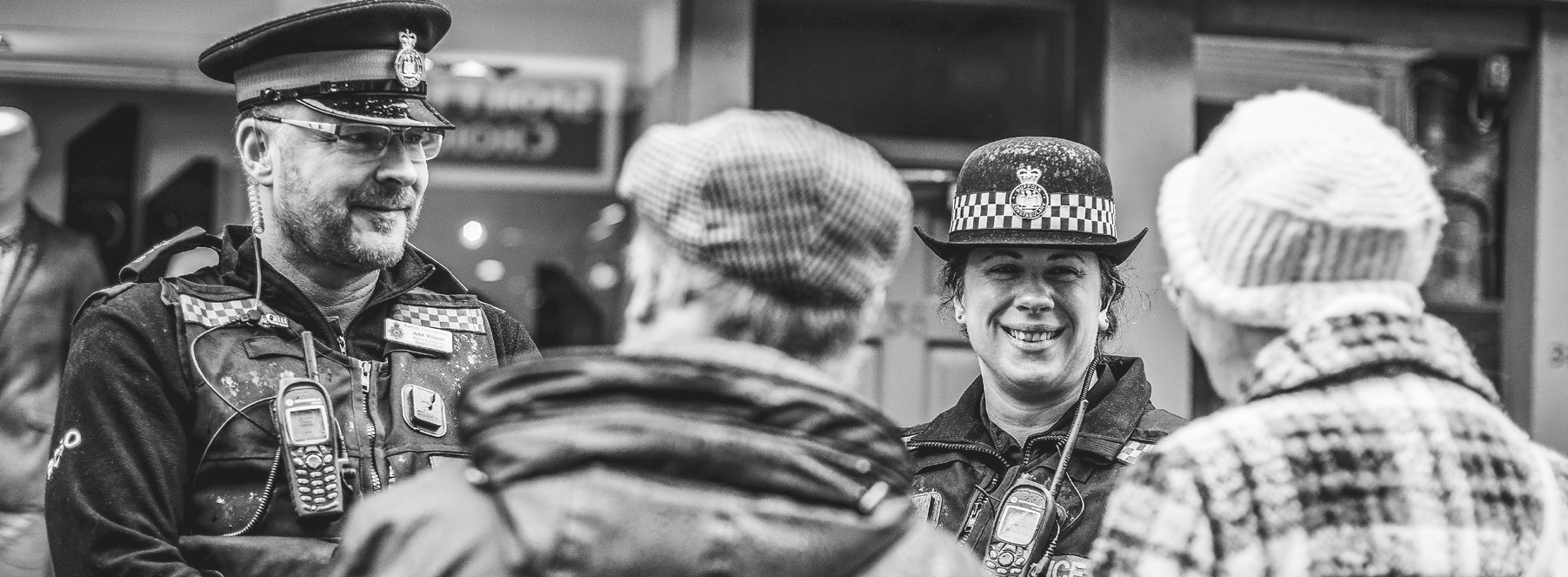Sussex police officers smiling at an older couple