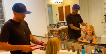 father styling daughter's hair